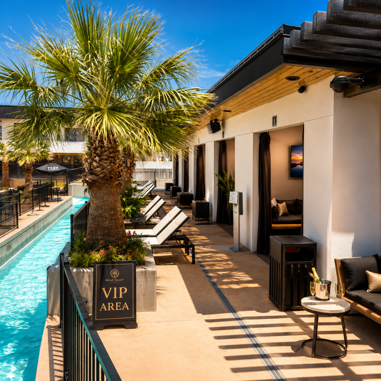 Private VIP cabana at the resort pool with white linen drapes and copper lanterns